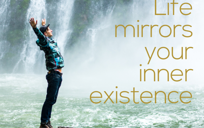 Life mirrors your inner existence; image of man near waterfalls with arms stretched up